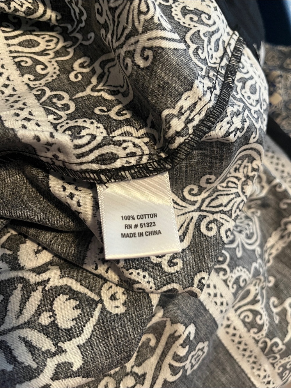 CeCe cotton poplin A-line midi skirt in black with a white botanical print. - Picture 7 of 7